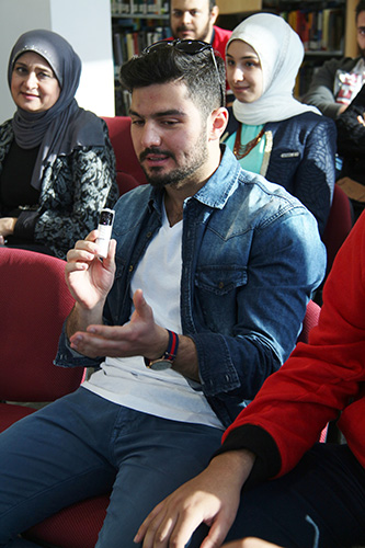 Auk library holds a poetry reading and book signing for yousef nayef