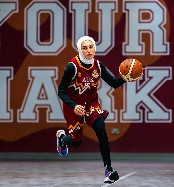 A new AUK student actively playing as part of the university’s basketball team.