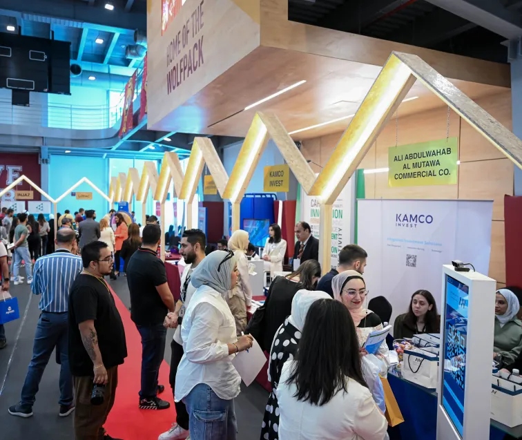 someone photographing an art on a wall in AUK